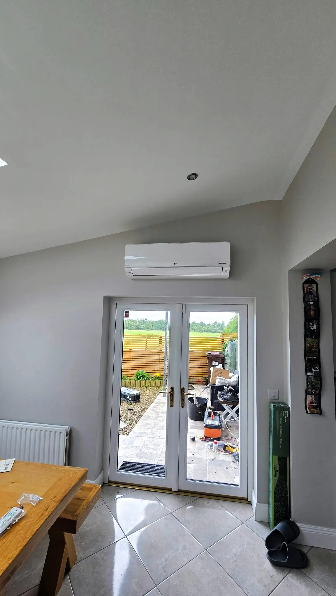 Air conditioner above patio doors in a kitchen extension