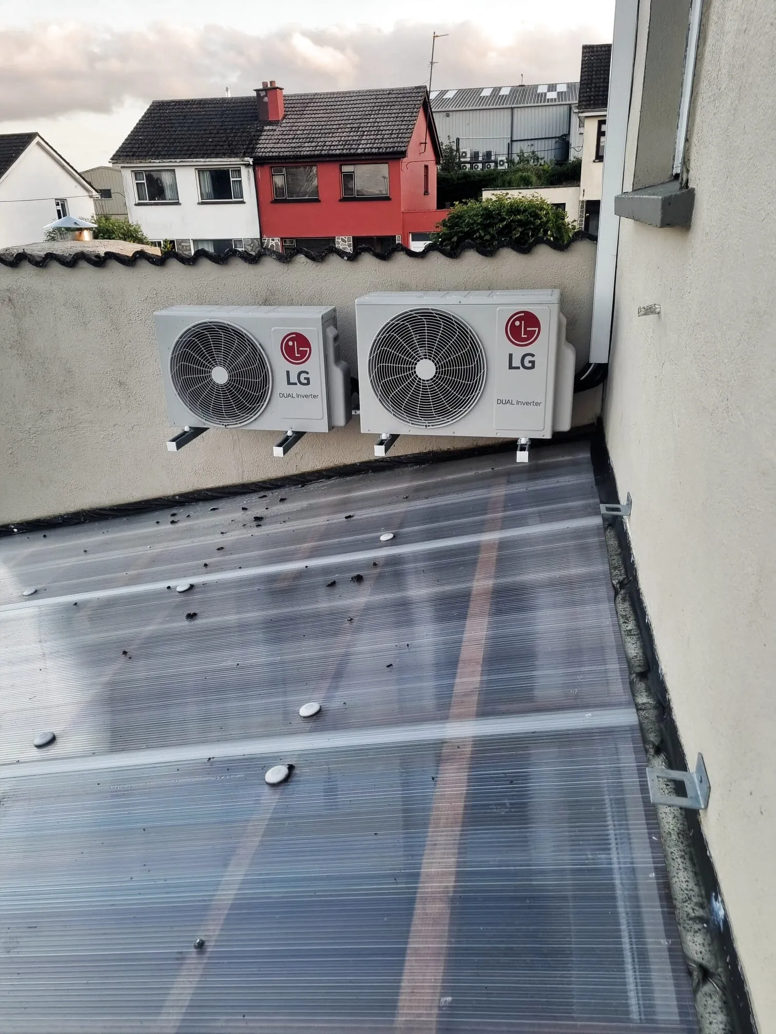 Two LG outdoor units on a flat roof