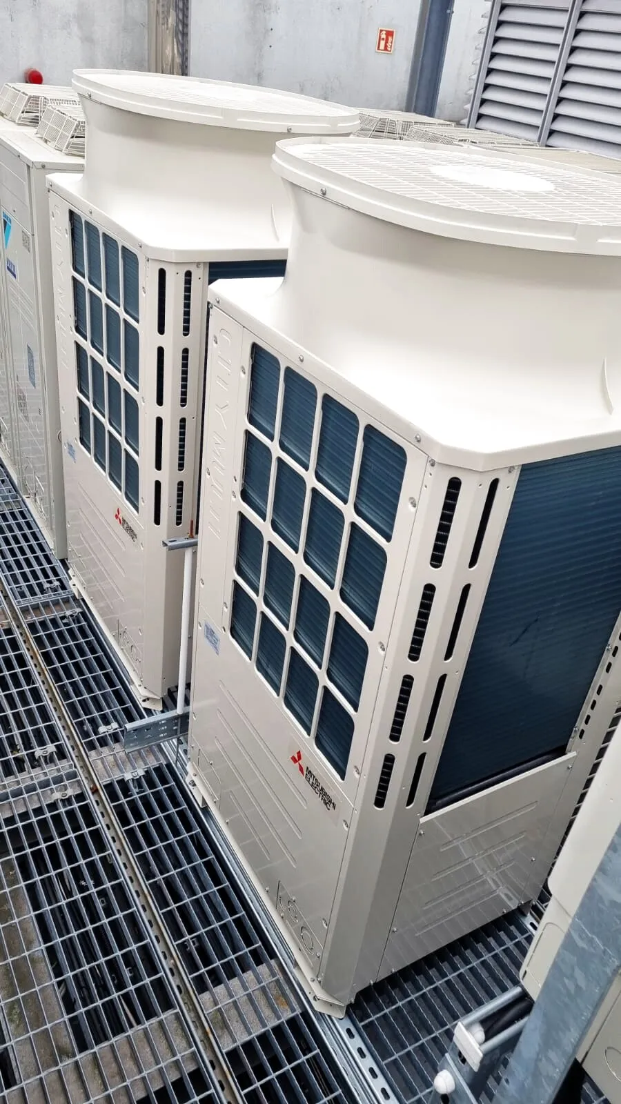 Mitsubishi Electric VRF units on a rooftop grille