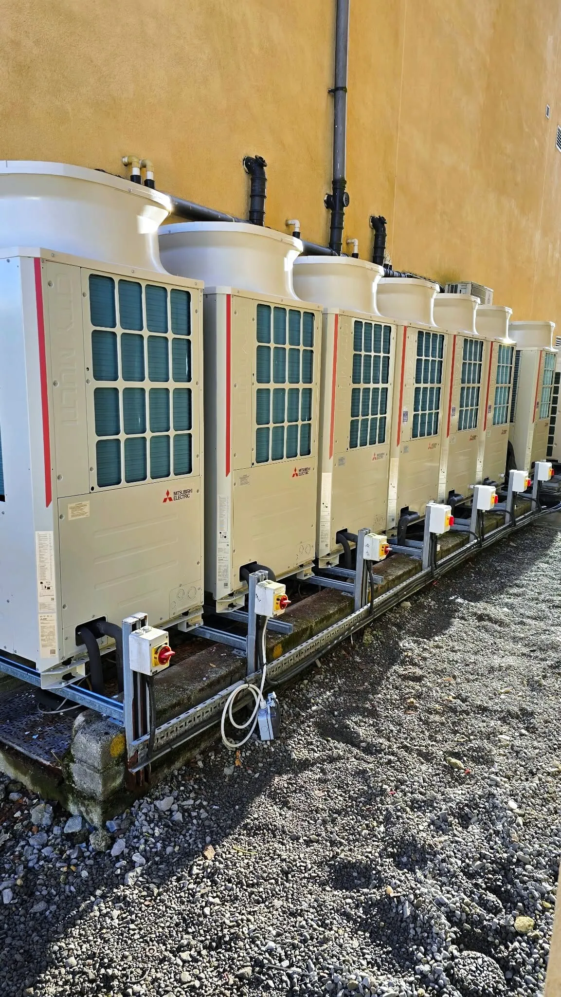 Mitsubishi VRF outdoor units on a steel frame